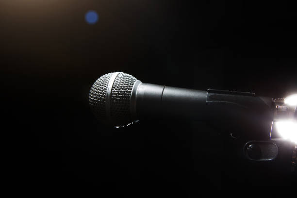 istock Black classic microphone on black dark background. 1137916597