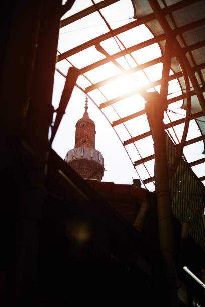Minaret through ruined roof
