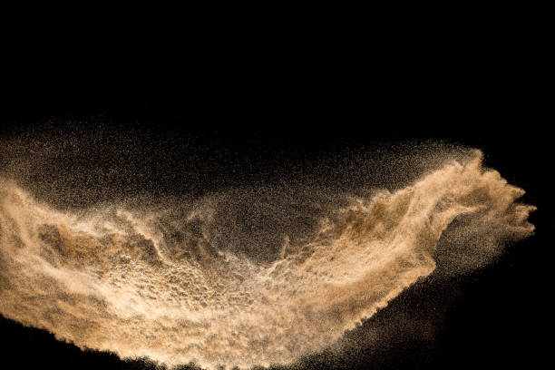 istock Golden dry river sand explosion isolated on white background. Abstract sand splashing. 1137921124