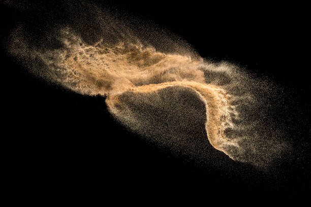 istock Golden dry river sand explosion isolated on white background. Abstract sand splashing. 1137921135
