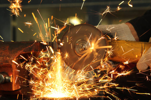 istock worker, grinder cuts metal and from this a huge amount of sparks 1137922074