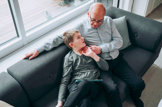 istock Family enjoys spending time together watching content on tablet at home 1137922719
