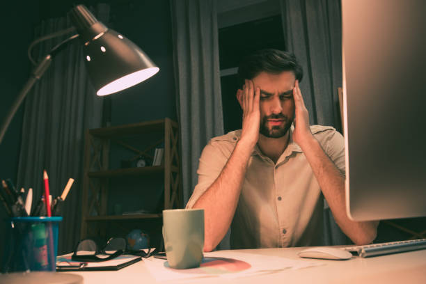 istock Portrait of successful businessman having headache after work 1137923416