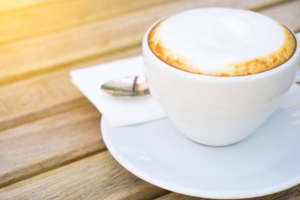 istock Coffee cup on the wooden desk 1137924655
