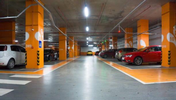 istock Cars in parking garage interior 1137925407