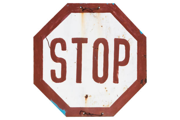 istock Old rusty non-standard road sign 'Stop' isolated on white. 1137925710