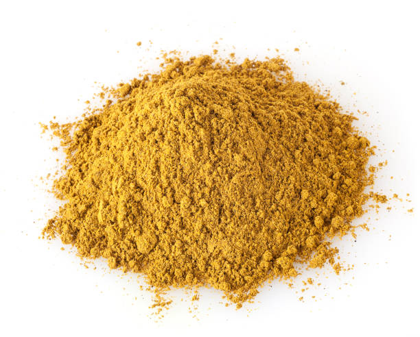 istock Heap of curry powder isolated on white background 1137928011