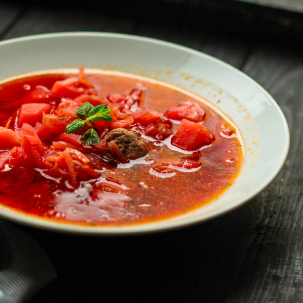 istock red tomato soup with vegetables, meat. first course. top.  food background. copy space 1137929224