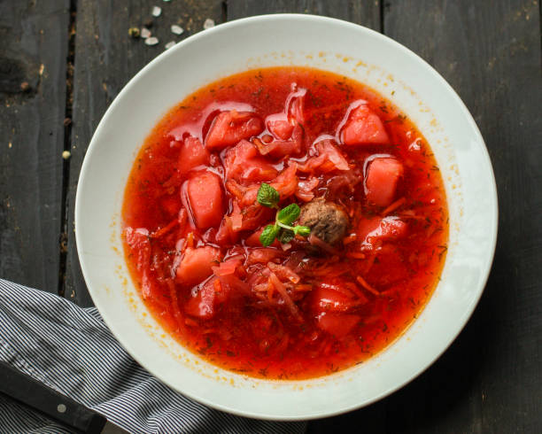 istock red tomato soup with vegetables, meat. first course. top.  food background. copy space 1137929230