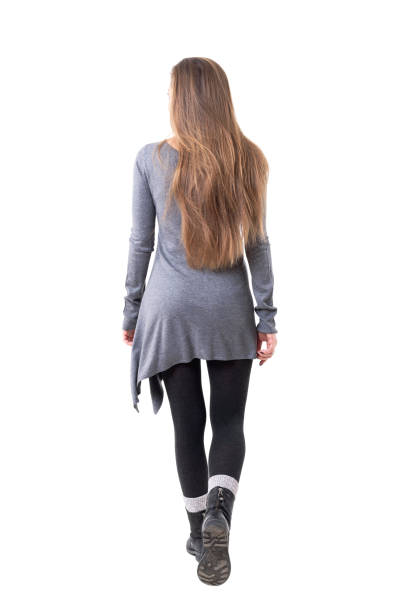 Rear view of casual young stylish woman with long flowing hair leaving Rear view of casual young stylish woman with long flowing hair leaving. Full body isolated on white background. people walking away stock pictures, royalty-free photos & images