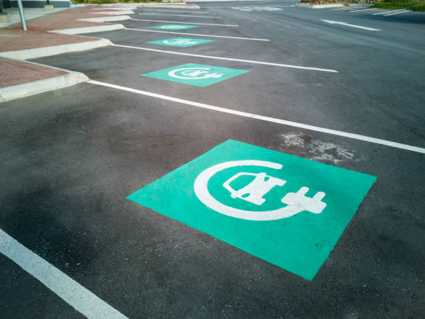 Electric car charging point parking with blue signs Electric car charging point parking with blue signs kinki region photos stock pictures, royalty-free photos & images