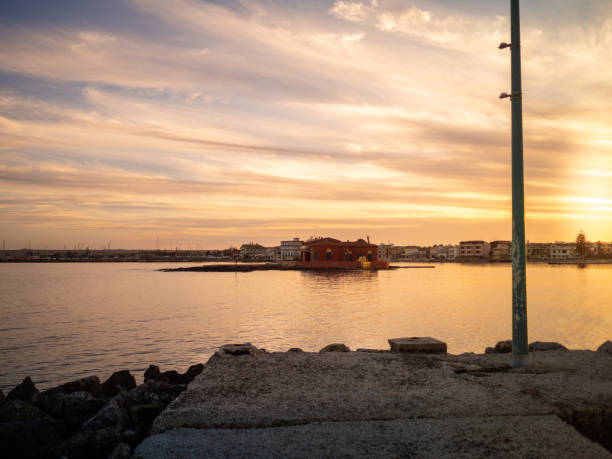 istock Beautiful sunset at Marzamemi and its little island 1137933548