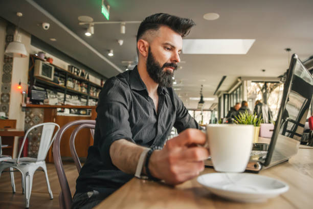 istock Young businessman working in cafe 1137933773