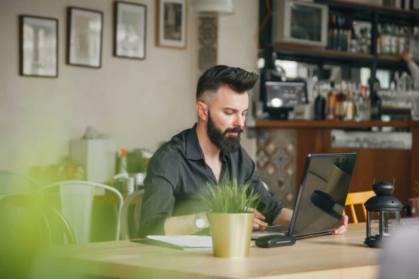 istock Young businessman working in cafe 1137934048