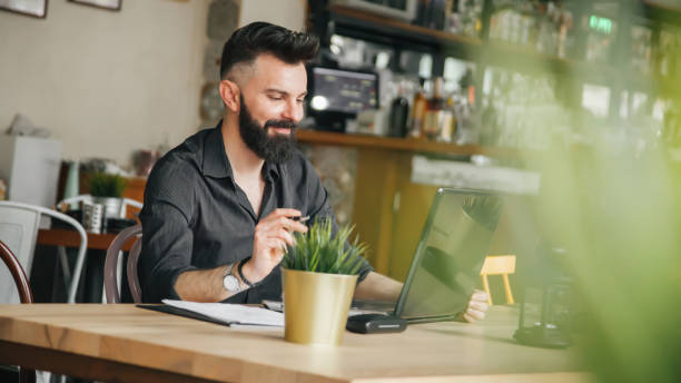 istock Young businessman working in cafe 1137934082
