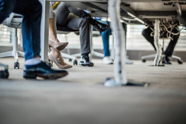 istock Legs under the table in the office! 1137937150