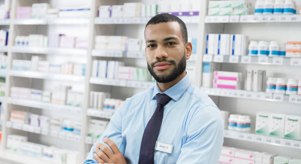 Portrait Of Young Pharmacist At Work stock photo
