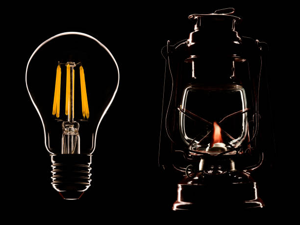 istock kerosene old lamp and led lamp on a black 1137940527