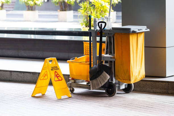 Janitorial and mop bucket on cleaning with caution wet floor sign. Janitorial and mop bucket on cleaning with caution wet floor sign. custodian stock pictures, royalty-free photos & images