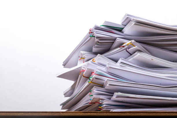 istock Stack of document paper with colorful paperclip 1137944429