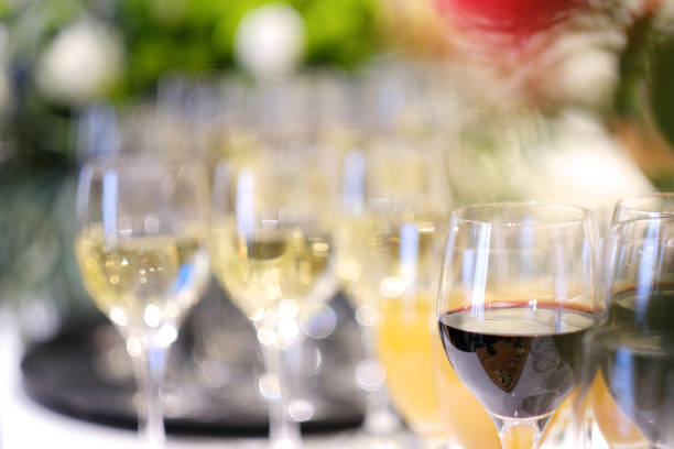 istock Glasses with red wine, juice and champagne 1137944558