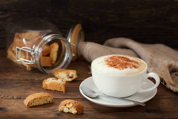istock cup of cappuccino coffee with cookies 1137945204