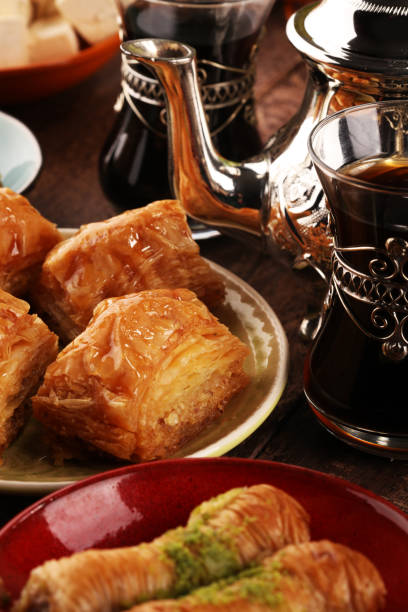 istock Middle eastern or arabic dishes and assorted meze, concrete rustic background. Turkish Bread or Turkish pizza. Dessert Baklava with pistachio. falafel with hommos.  Halal food. Lebanese cuisine 1137946897