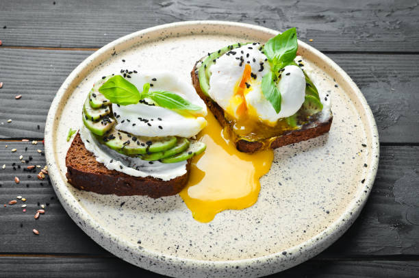istock Sandwich with Philadelphia cheese, avocado and egg. Top view. Free space for your text. Rustic style. 1137947258