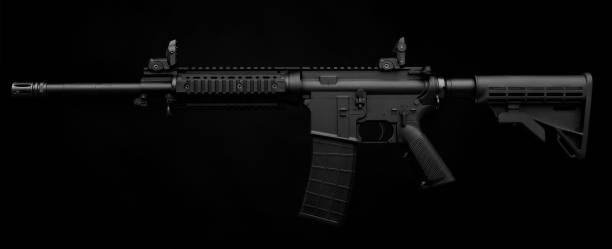 istock Gun rifle isolated on black background 1137949626