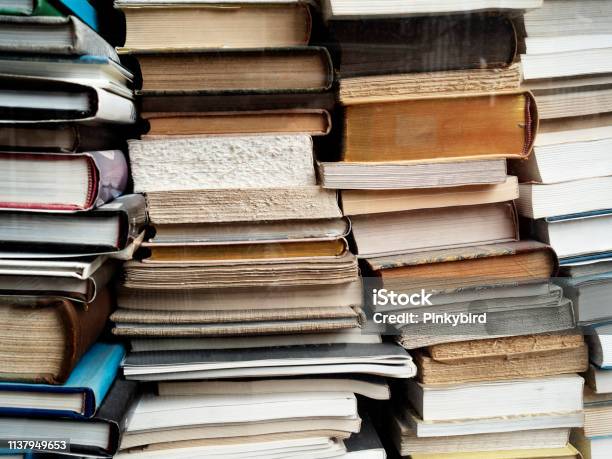 Old Books Stackedshop Windowbooksa Stack Of Books In The Library By The Windowbackgrounds Stock Photo - Download Image Now