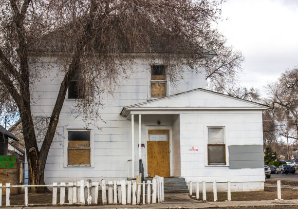 istock Abandoned House With Boarded Up Windows & Door 1137949796