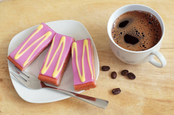 istock Slices of layers cake with icing and coffee 1137949881