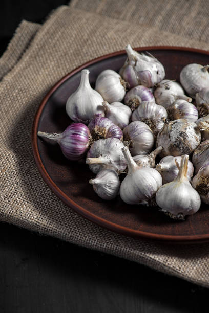 istock Fresh garlic in a basket on burlap 1137953657