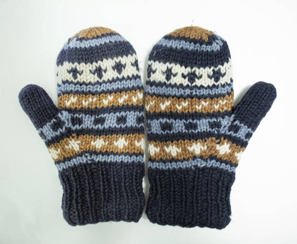istock hand knit gloves with blue gold and white pattern 1137955072