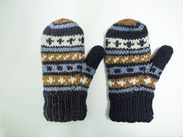 istock hand knit gloves with blue gold and white pattern 1137955074