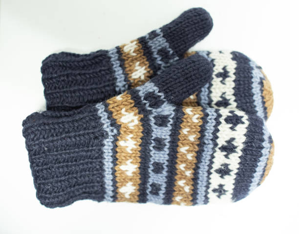 istock hand knit gloves with blue gold and white pattern 1137955087