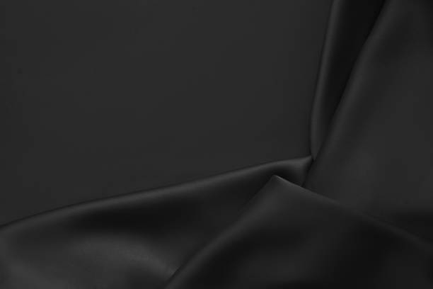 istock Black luxury wavy rippled glossy silk drapery cloth fabric 1137955224