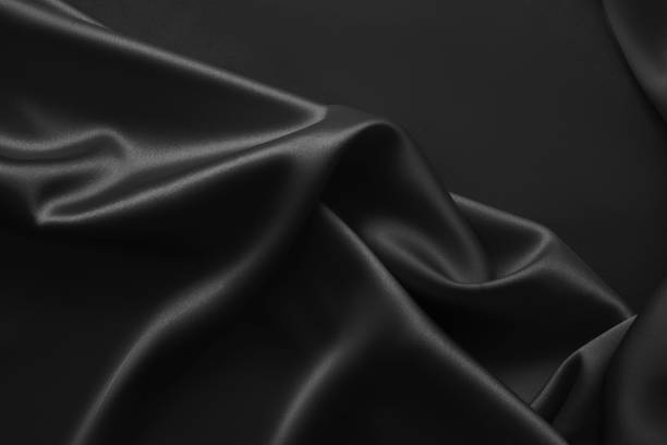 istock Black luxury wavy rippled glossy silk drapery cloth fabric 1137955721
