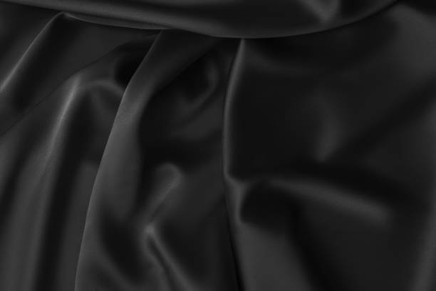 istock Black luxury wavy rippled glossy silk drapery cloth fabric 1137956542