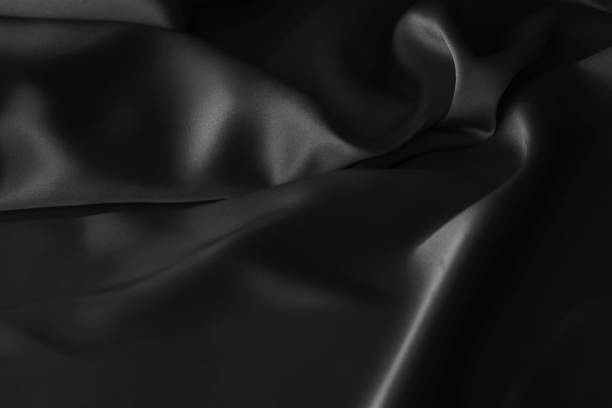 istock Black luxury wavy rippled glossy silk drapery cloth fabric 1137956822