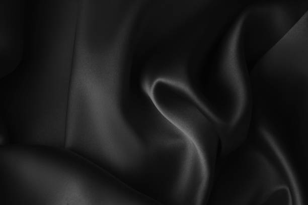 istock Black luxury wavy rippled glossy silk drapery cloth fabric 1137956861