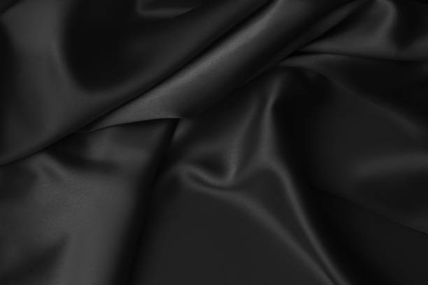 istock Black luxury wavy rippled glossy silk drapery cloth fabric 1137956965