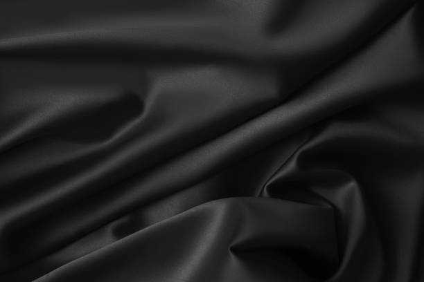 istock Black luxury wavy rippled glossy silk drapery cloth fabric 1137957161