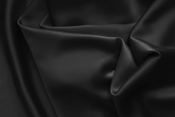 istock Black luxury wavy rippled glossy silk drapery cloth fabric 1137957797