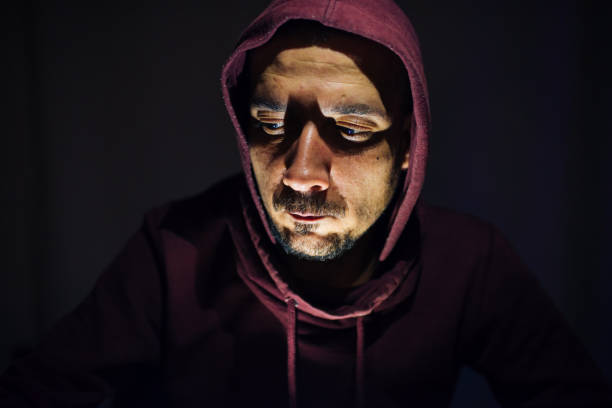 istock Computer Hacker in Hoodie in Darkness 1137957857