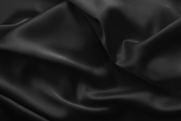 istock Black luxury wavy rippled glossy silk drapery cloth fabric 1137957882