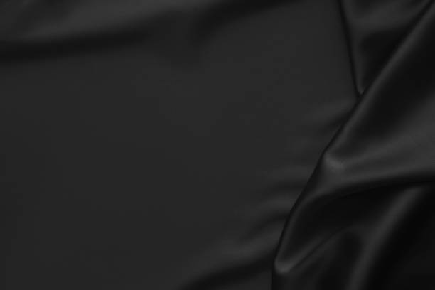 istock Black luxury wavy rippled glossy silk drapery cloth fabric 1137957894