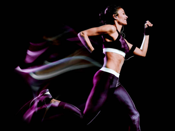 istock beautiful woman runner jogger jogging running isolated black background 1137958089
