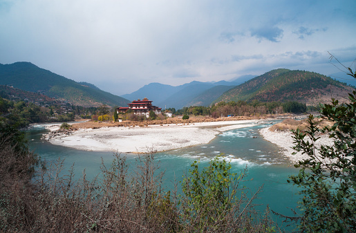 Punakha Dzong is ancient capital of Bhutan. It presently serves as summer residence for the central monastic body. It is one of the historic and important Dzongs in Bhutan. It is situated between two major rivers - Phochhu river on the right and Mochhu river on the left. The picture features Dzong in between two river.