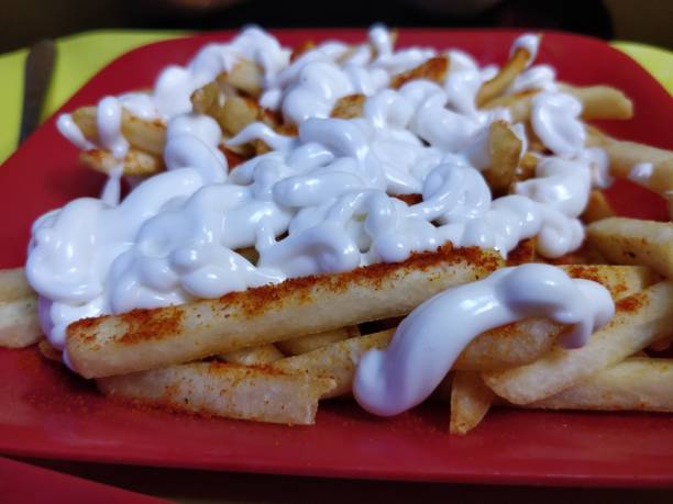 istock French fries with white sauce or cream 1137959265